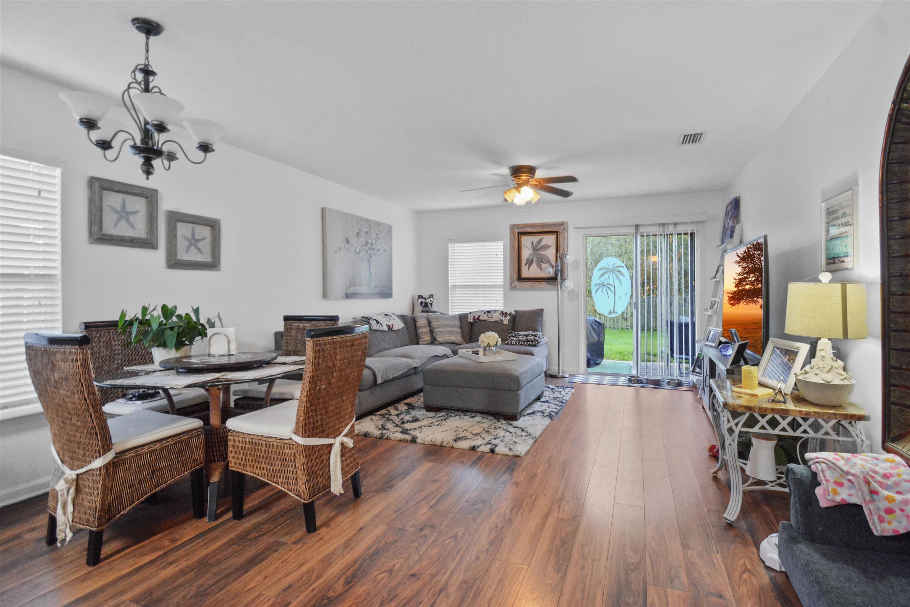 279 Buck Run Way St. Augustine, FL 32092 - Photo 5 of 28 a living room with furniture and wooden floor