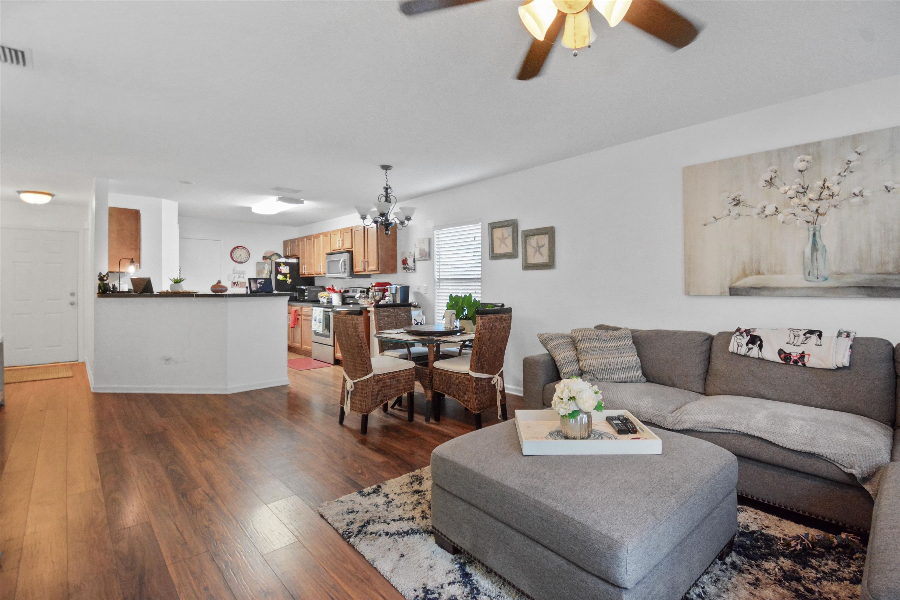 279 Buck Run Way St. Augustine, FL 32092 - Photo 7 of 28 a living room with furniture and kitchen view