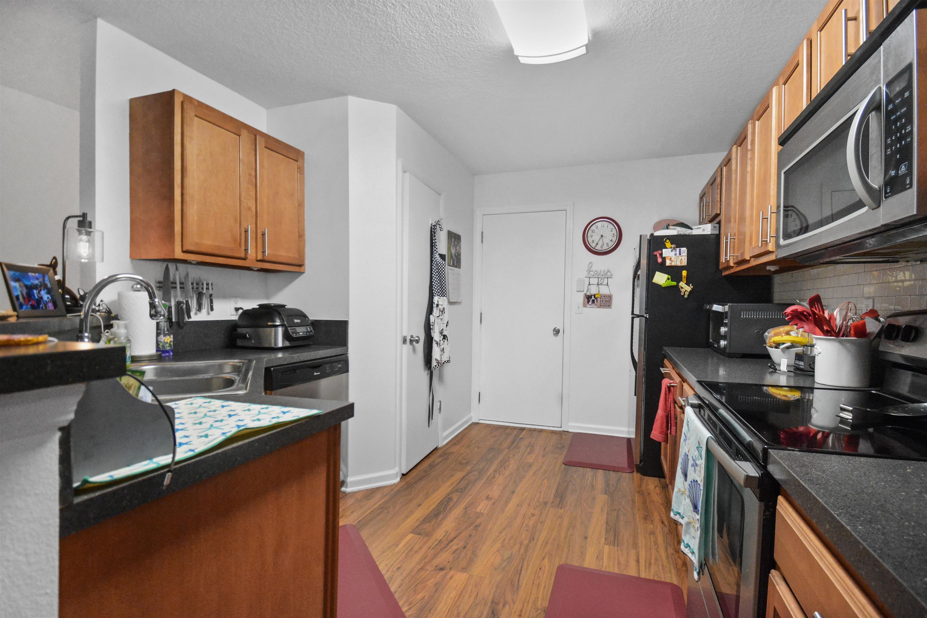 279 Buck Run Way St. Augustine, FL 32092 - Photo 10 of 28 a kitchen with stainless steel appliances granite countertop a stove and a refrigerator