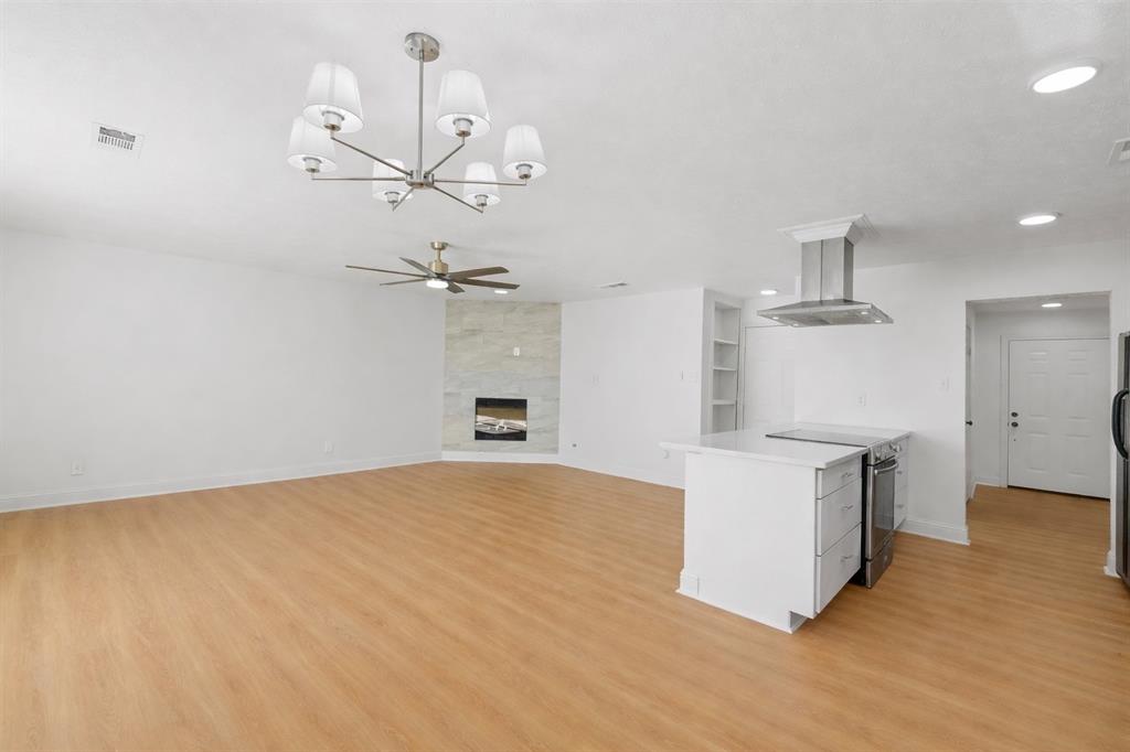 5516 Maple Lane Rowlett, TX 75089 - Photo 9 of 18 a view of a kitchen with a sink and a refrigerator
