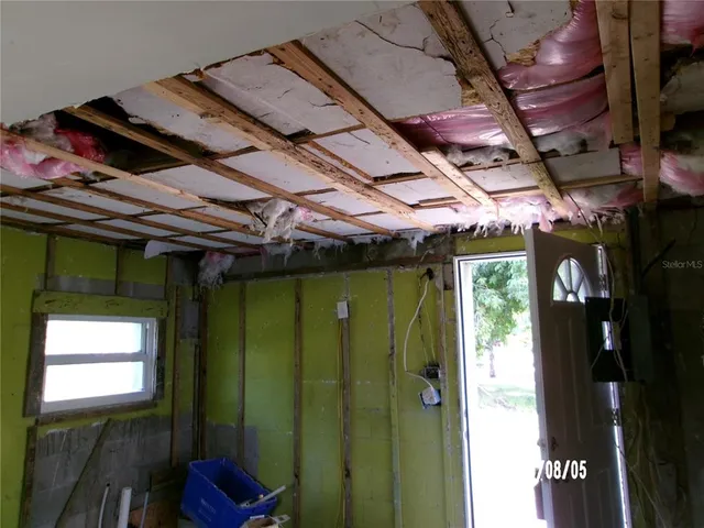 a view of a room with wooden walls