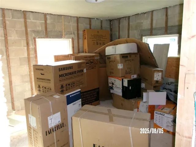 a kitchen with a refrigerator and a stove