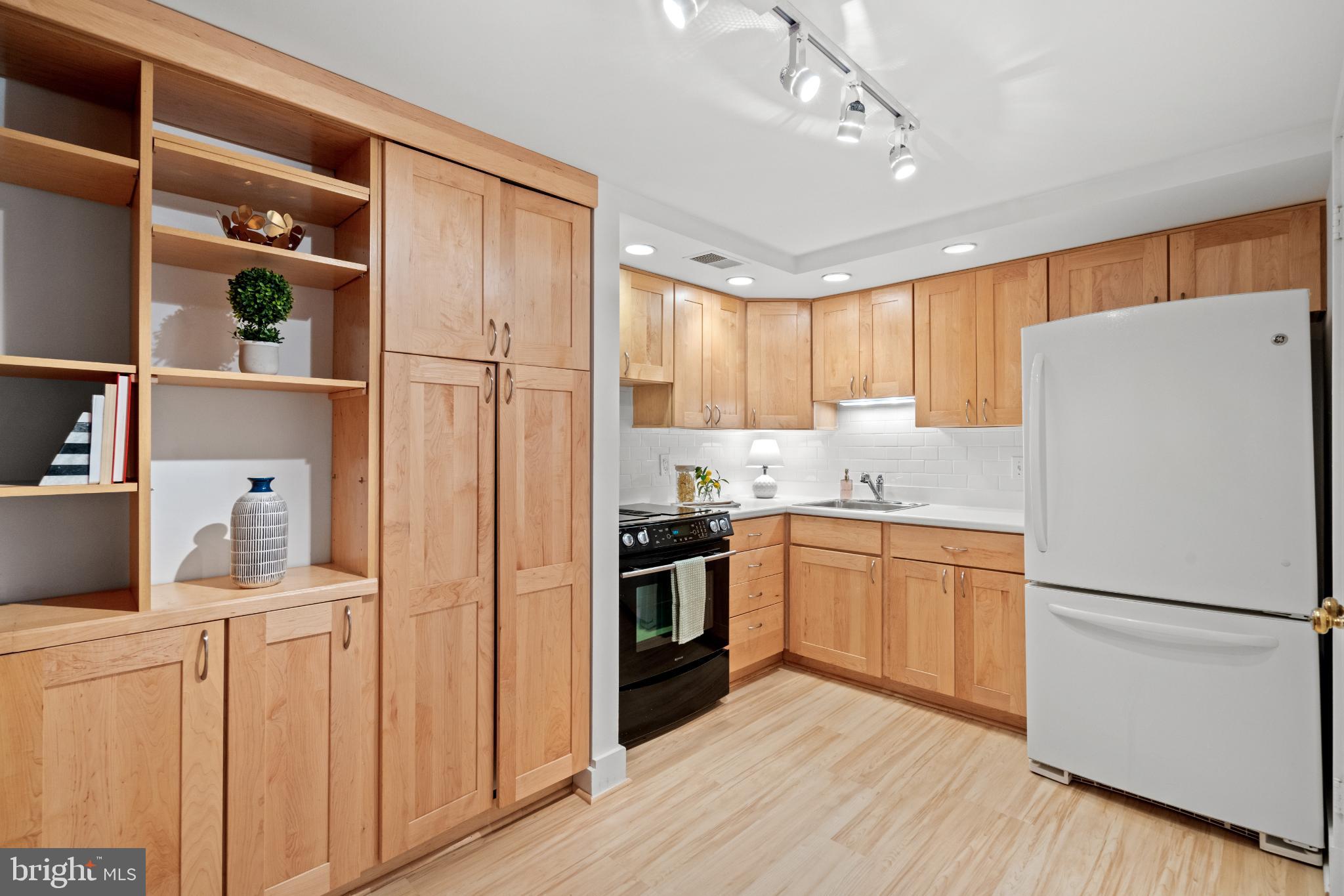 1915 Calvert Street Northwest, Unit 3 Washington, DC 20009 - Photo 6 of 13 Modern kitchen with warm wood cabinetry
