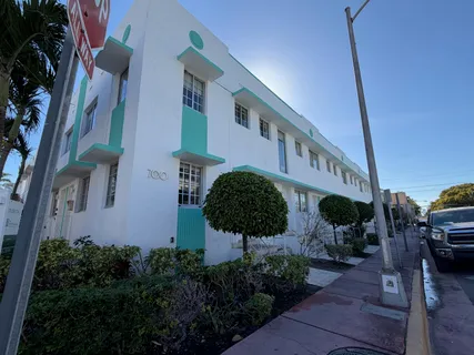 a view of a building with potted plants