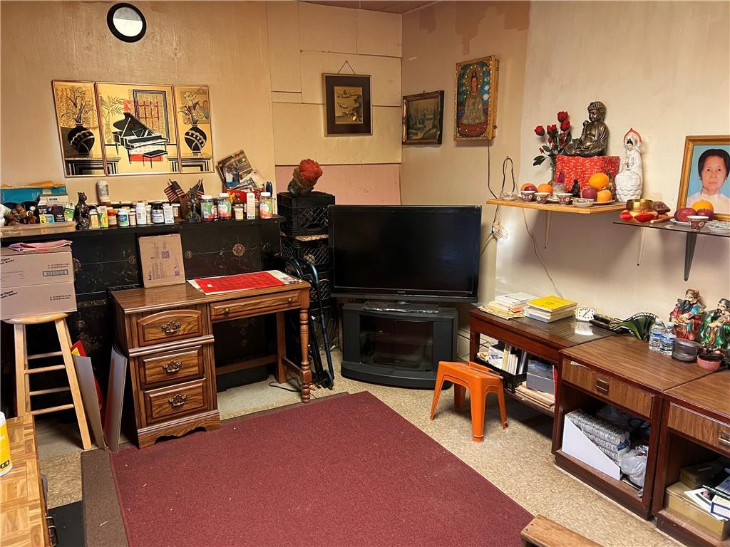 314 North Mathilda Street Pittsburgh, PA 15224 - Photo 3 of 11 a room with furniture a flat screen tv and a fireplace