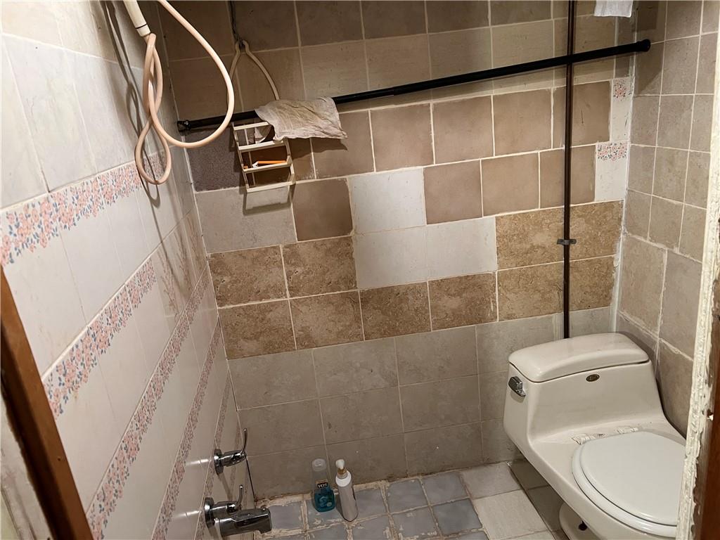 314 North Mathilda Street Pittsburgh, PA 15224 - Photo 7 of 11 a bathroom with a toilet and a shower