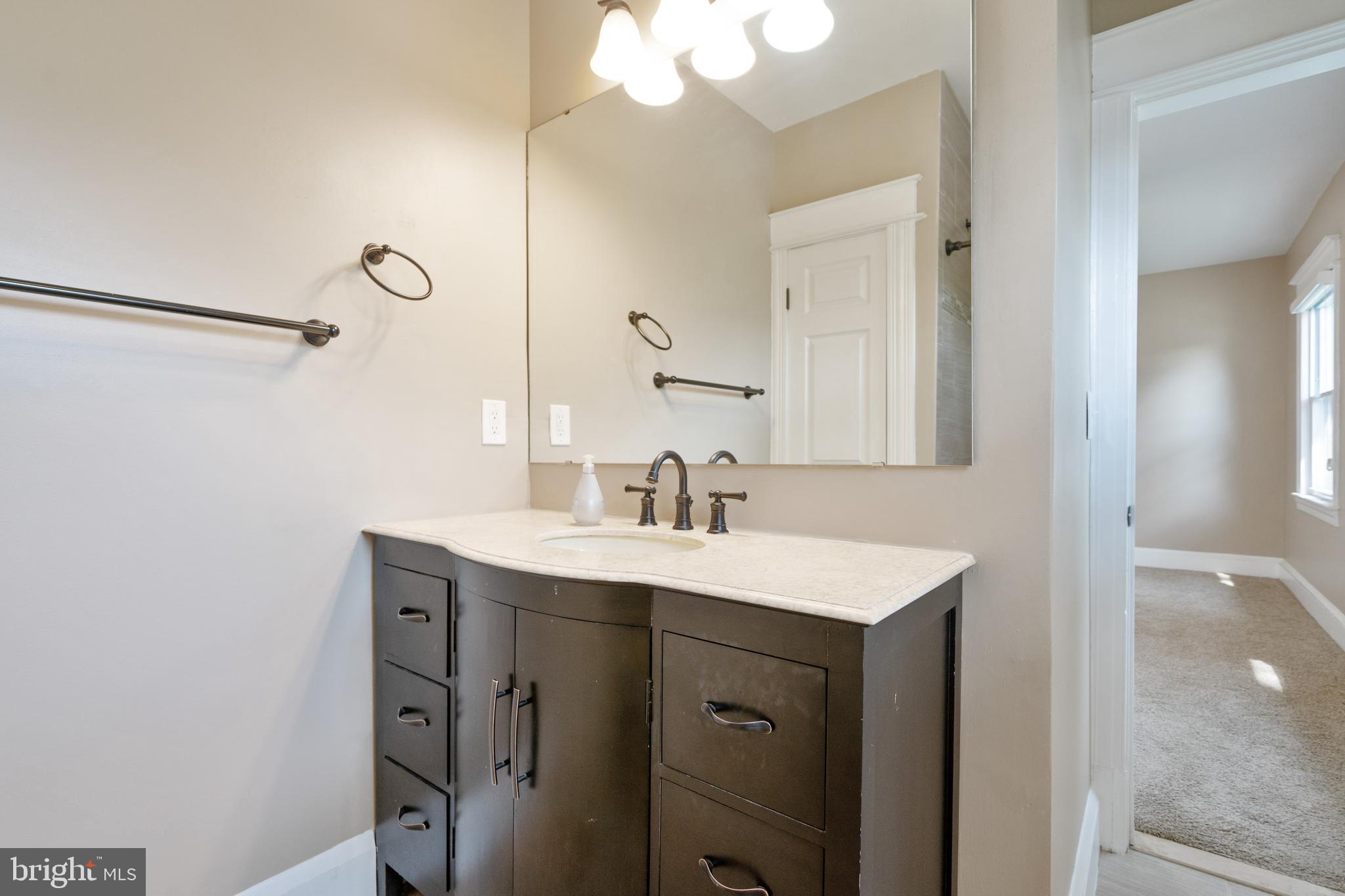 1955 Seminary Road Silver Spring, MD 20910 - Photo 19 of 41 a bathroom with a sink vanity and a mirror