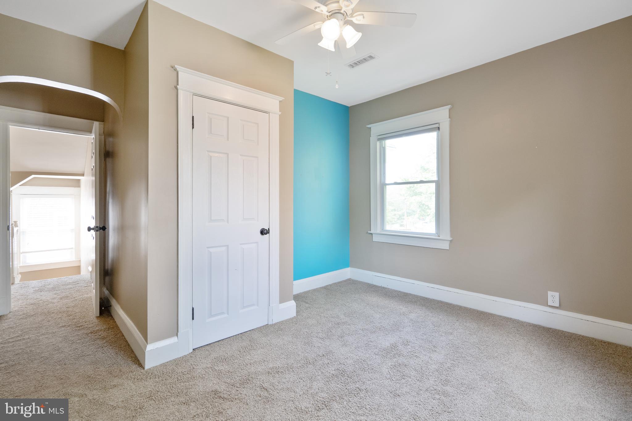 1955 Seminary Road Silver Spring, MD 20910 - Photo 24 of 41 wooden floor in an empty room with a window