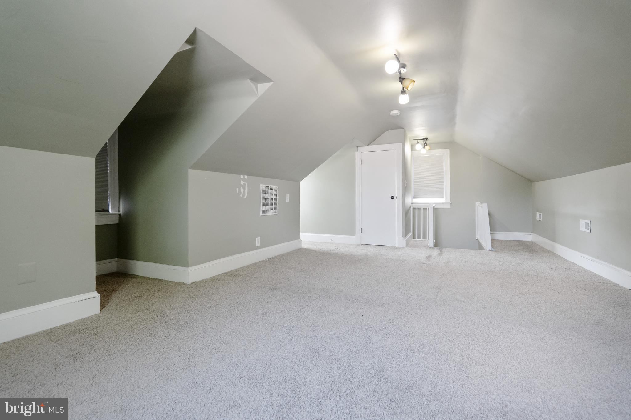 1955 Seminary Road Silver Spring, MD 20910 - Photo 28 of 41 en empty room with windows and ceiling fan