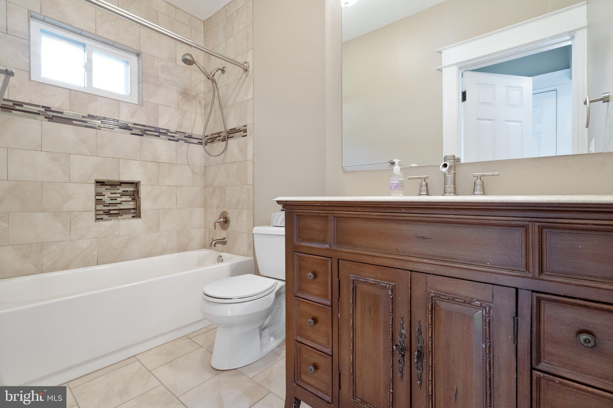 1955 Seminary Road Silver Spring, MD 20910 - Photo 30 of 41 a bathroom with a sink a toilet and a bathtub