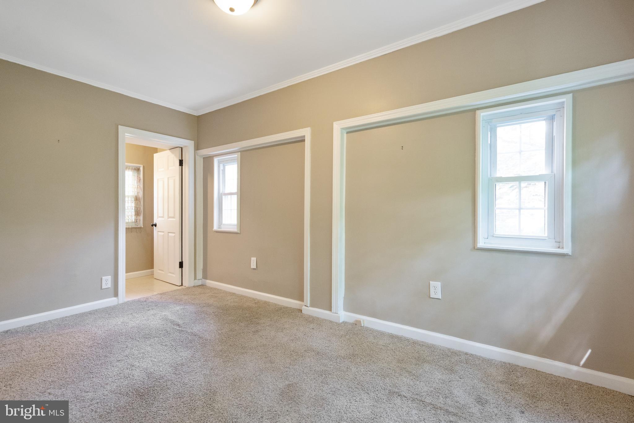 1955 Seminary Road Silver Spring, MD 20910 - Photo 31 of 41 a view of an empty room with window and closet area