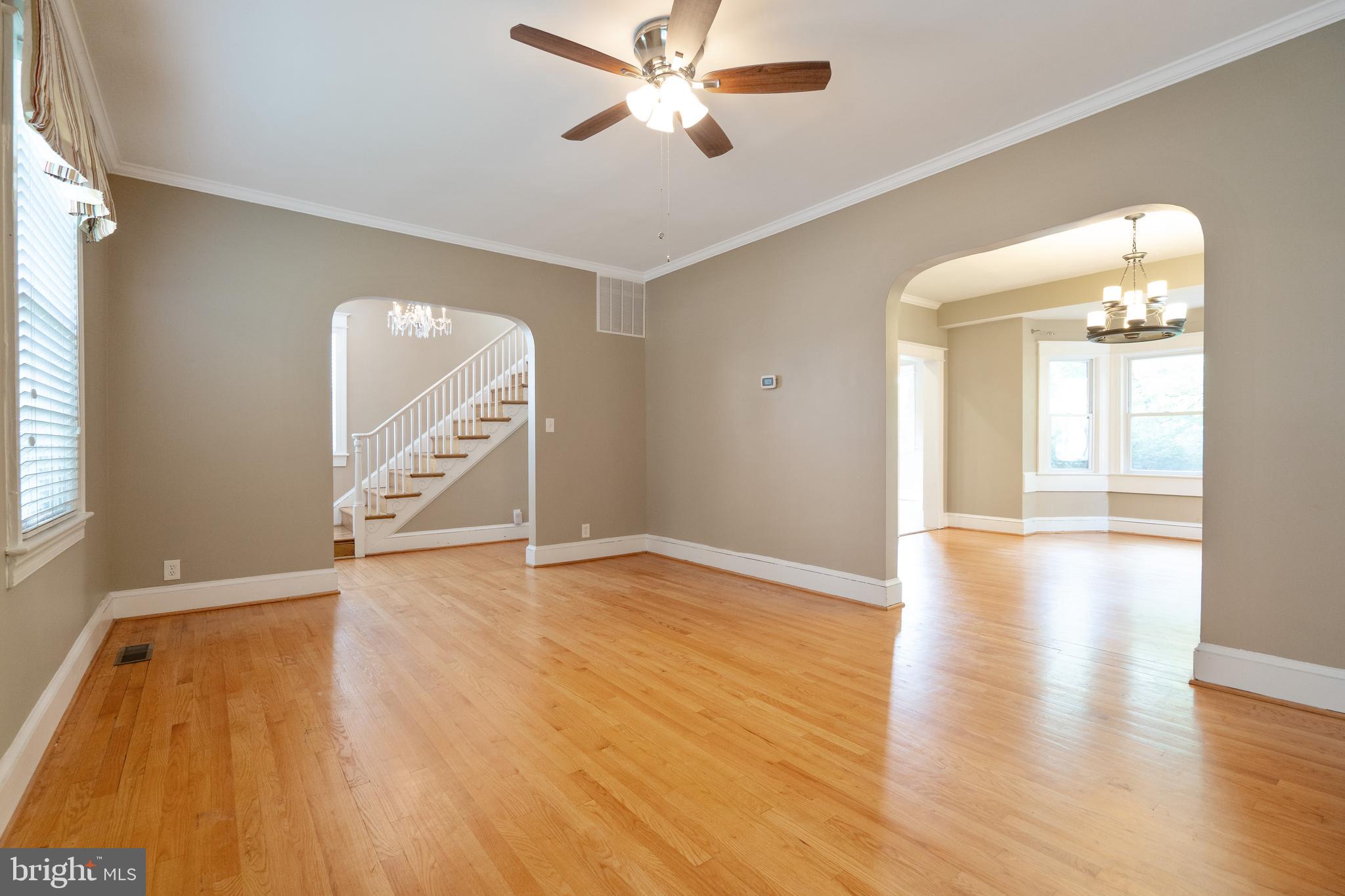1955 Seminary Road Silver Spring, MD 20910 - Photo 5 of 41 wooden floor in an empty room with a window