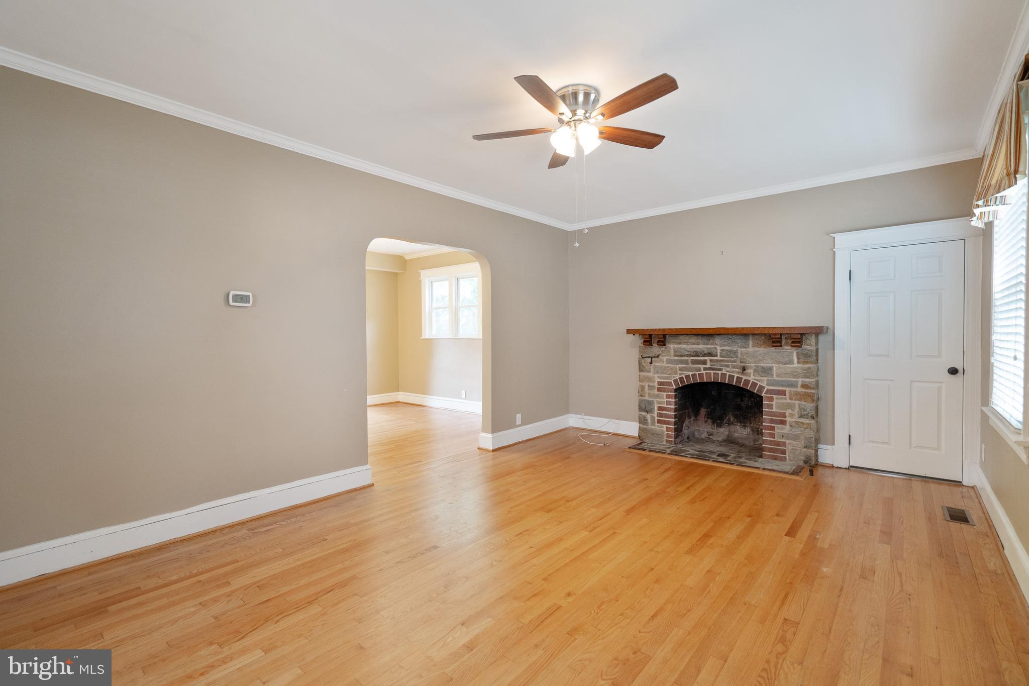 1955 Seminary Road Silver Spring, MD 20910 - Photo 6 of 41 a view of an empty room with wooden floor and a window