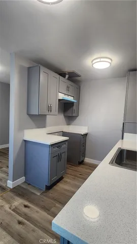 a kitchen with stainless steel appliances granite countertop a sink a stove a microwave and island