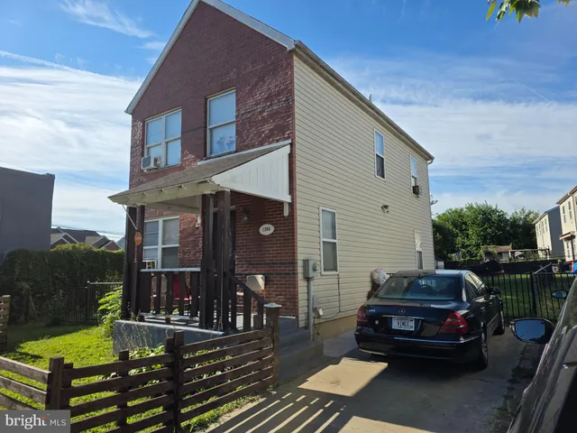 a car parked in front of a house