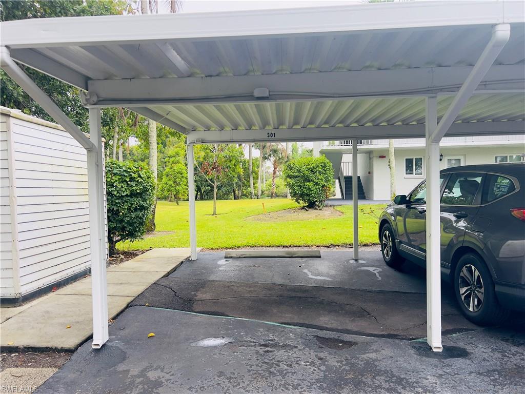 5515 Rattlesnake Hamm Road, Unit 301 Naples, FL 34113 - Photo 22 of 31 1 Assigned Carport