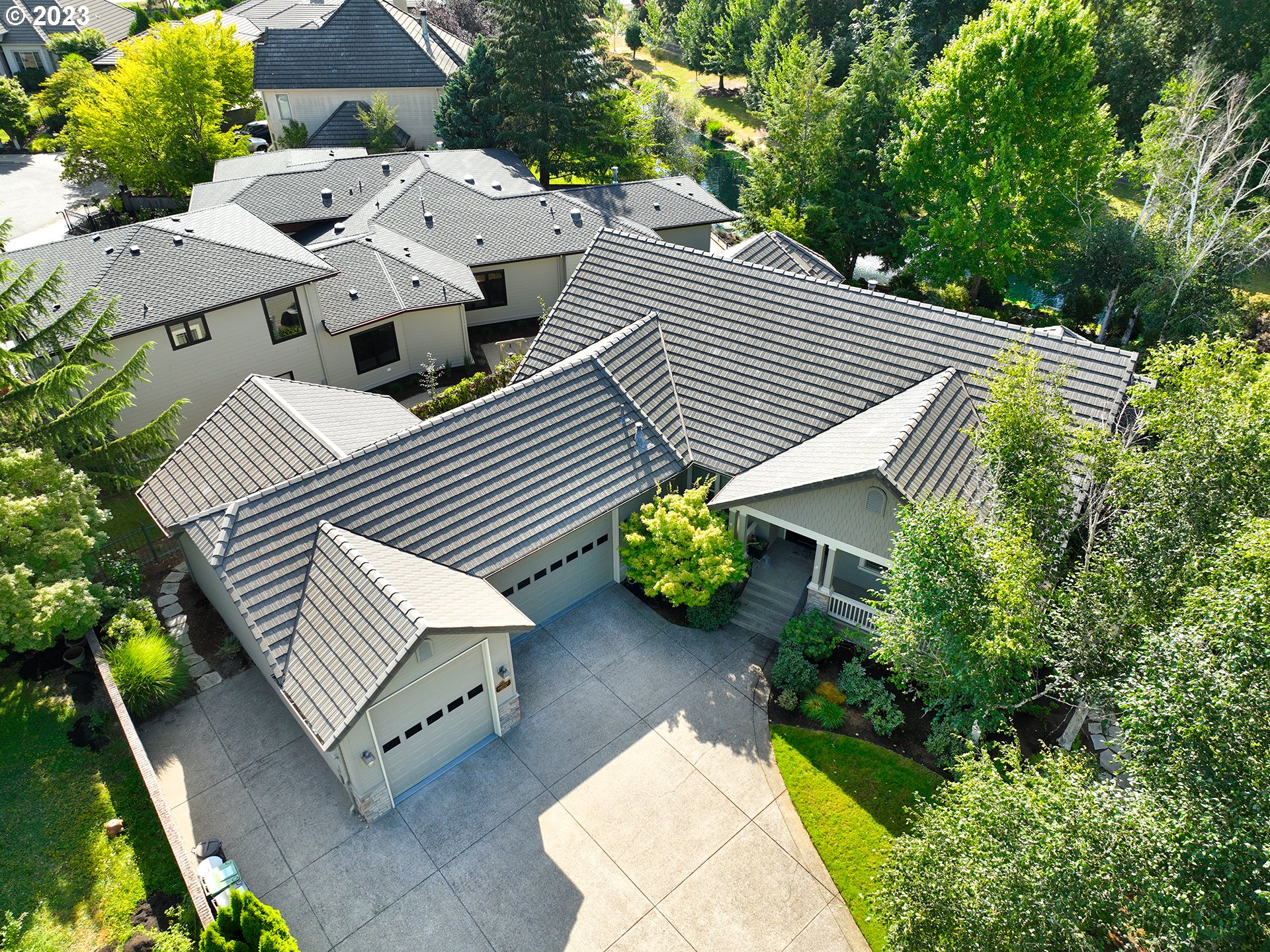 an aerial view of a house with balcony and garden
