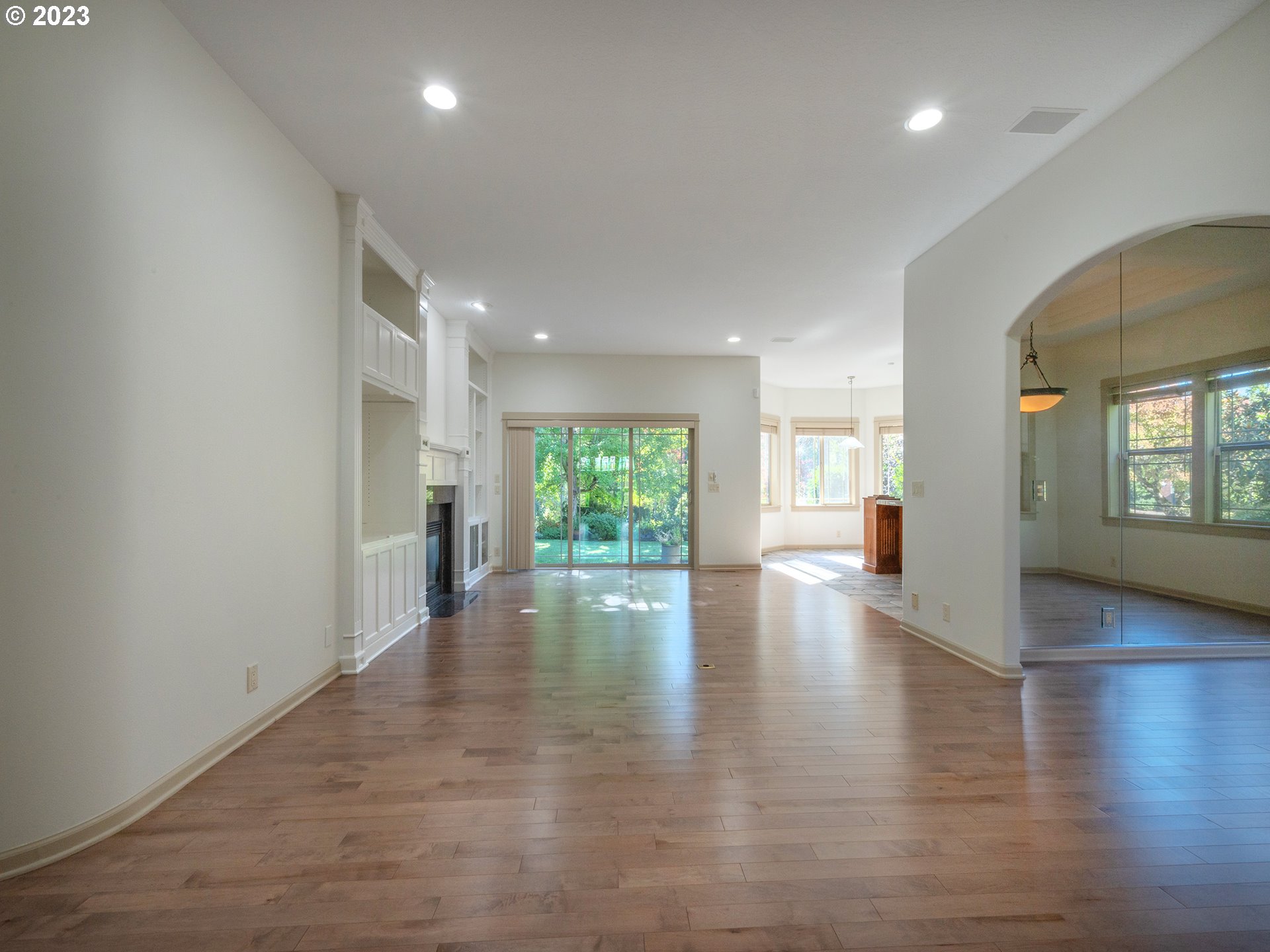 3384 Lakeside Drive Eugene, OR 97401 - Photo 45 of 48 an empty room with wooden floor and windows