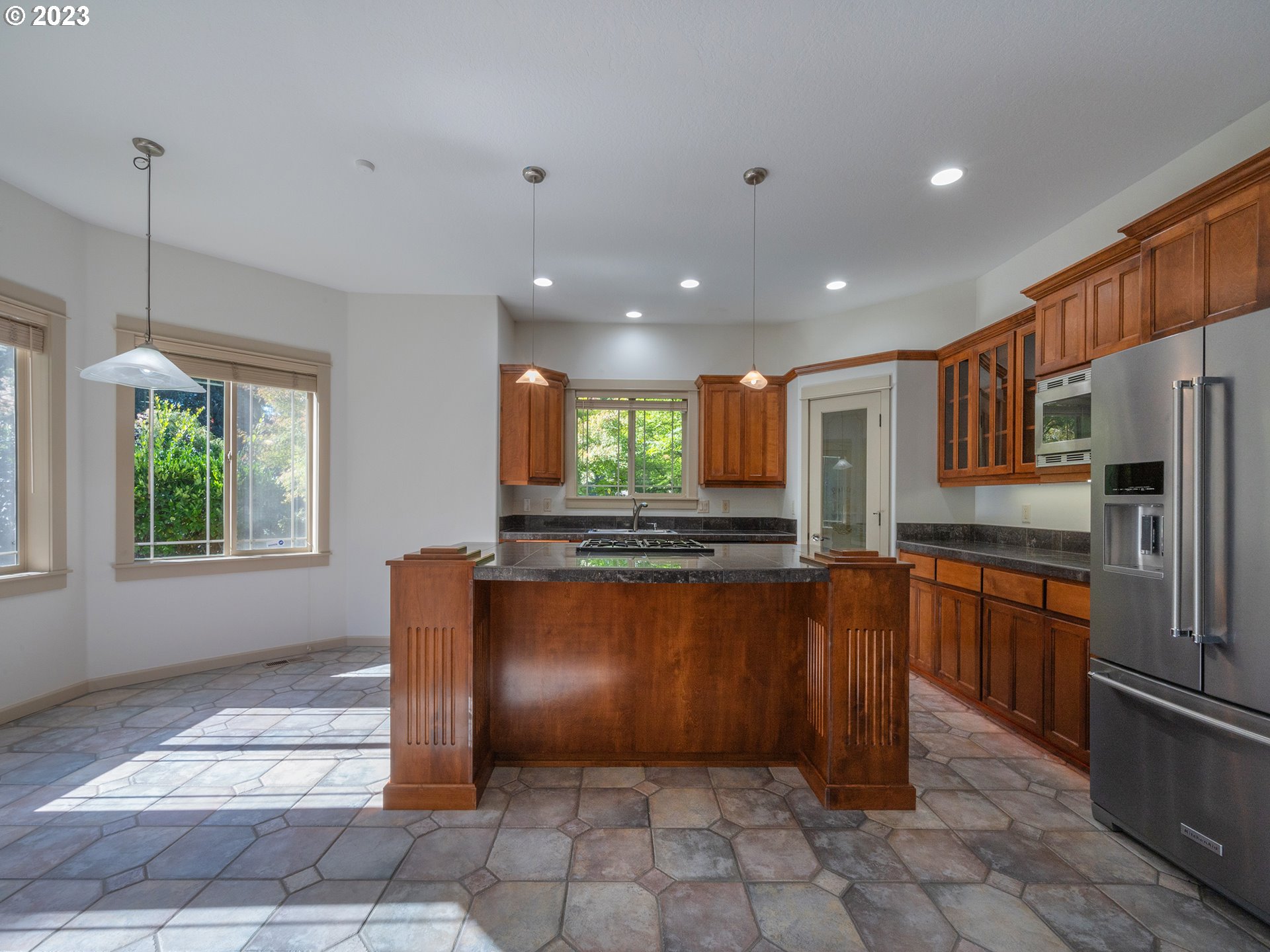 3384 Lakeside Drive Eugene, OR 97401 - Photo 11 of 48 a kitchen with stainless steel appliances granite countertop a refrigerator and a sink