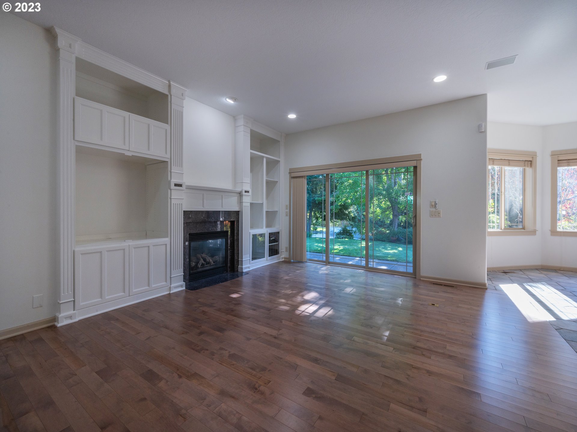 3384 Lakeside Drive Eugene, OR 97401 - Photo 17 of 48 a view of a room wooden floor and a fireplace