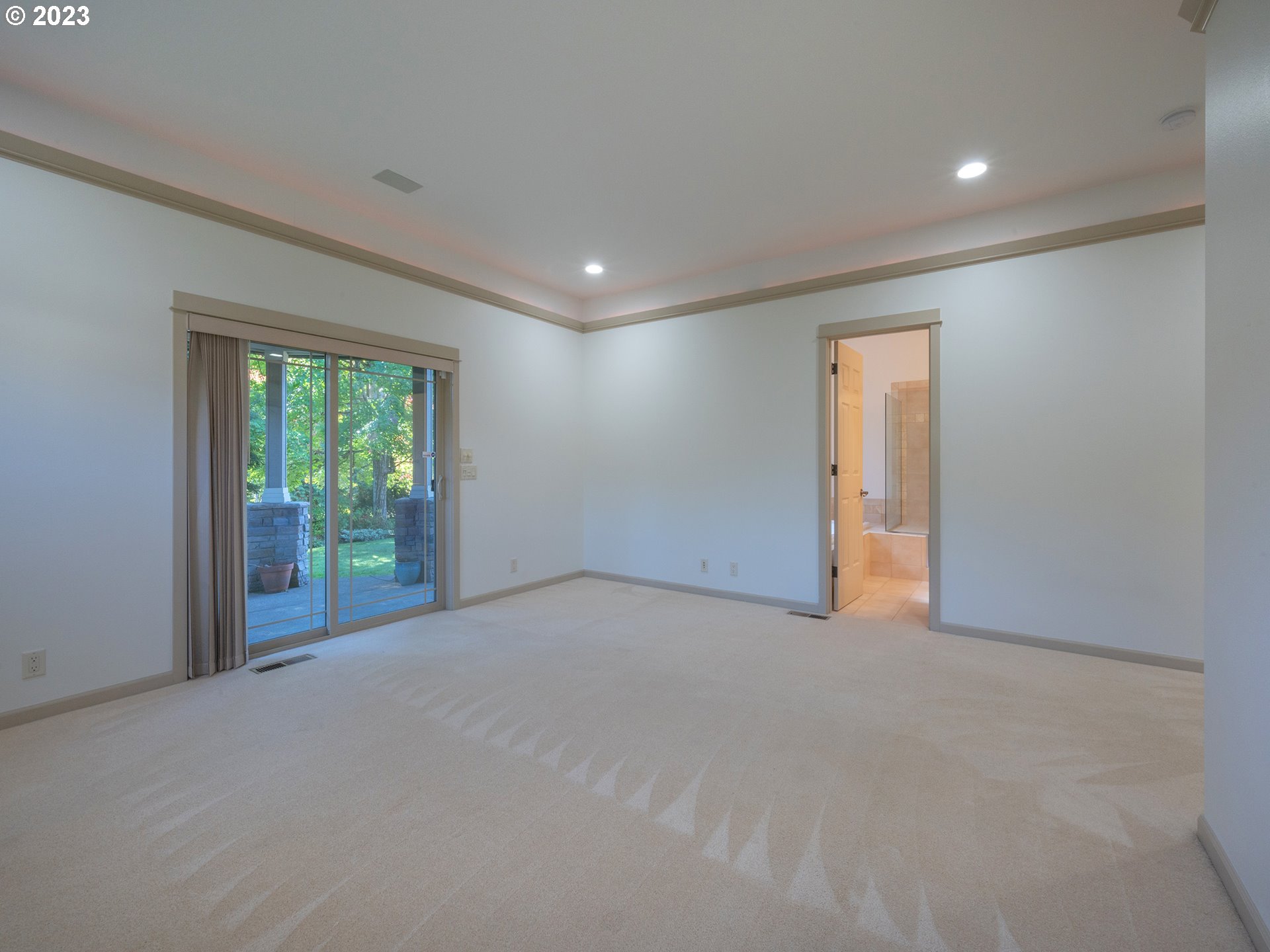 3384 Lakeside Drive Eugene, OR 97401 - Photo 21 of 48 a view of an empty room with wooden floor and a window