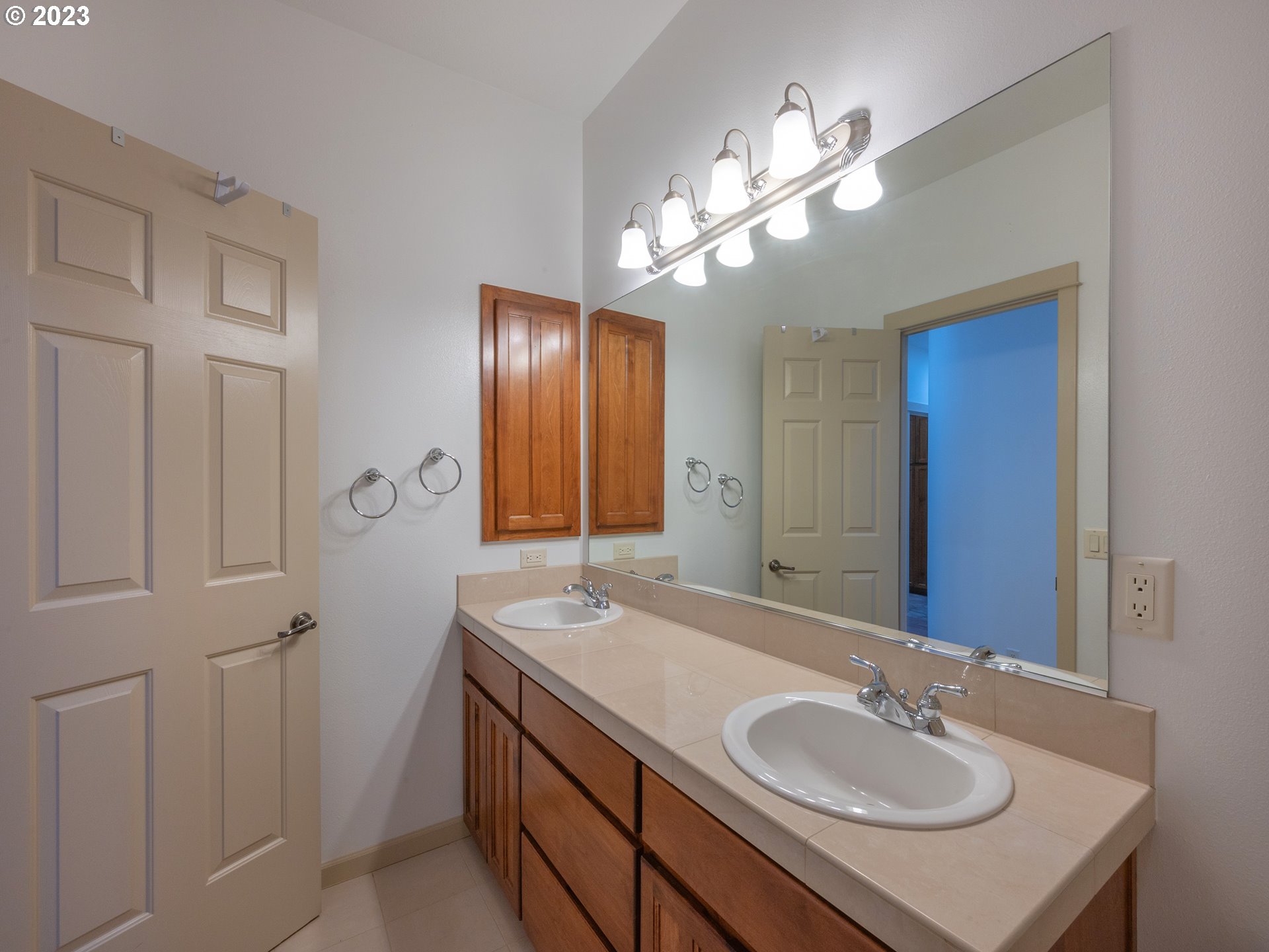 3384 Lakeside Drive Eugene, OR 97401 - Photo 32 of 48 a bathroom with a sink double vanity granite and a mirror