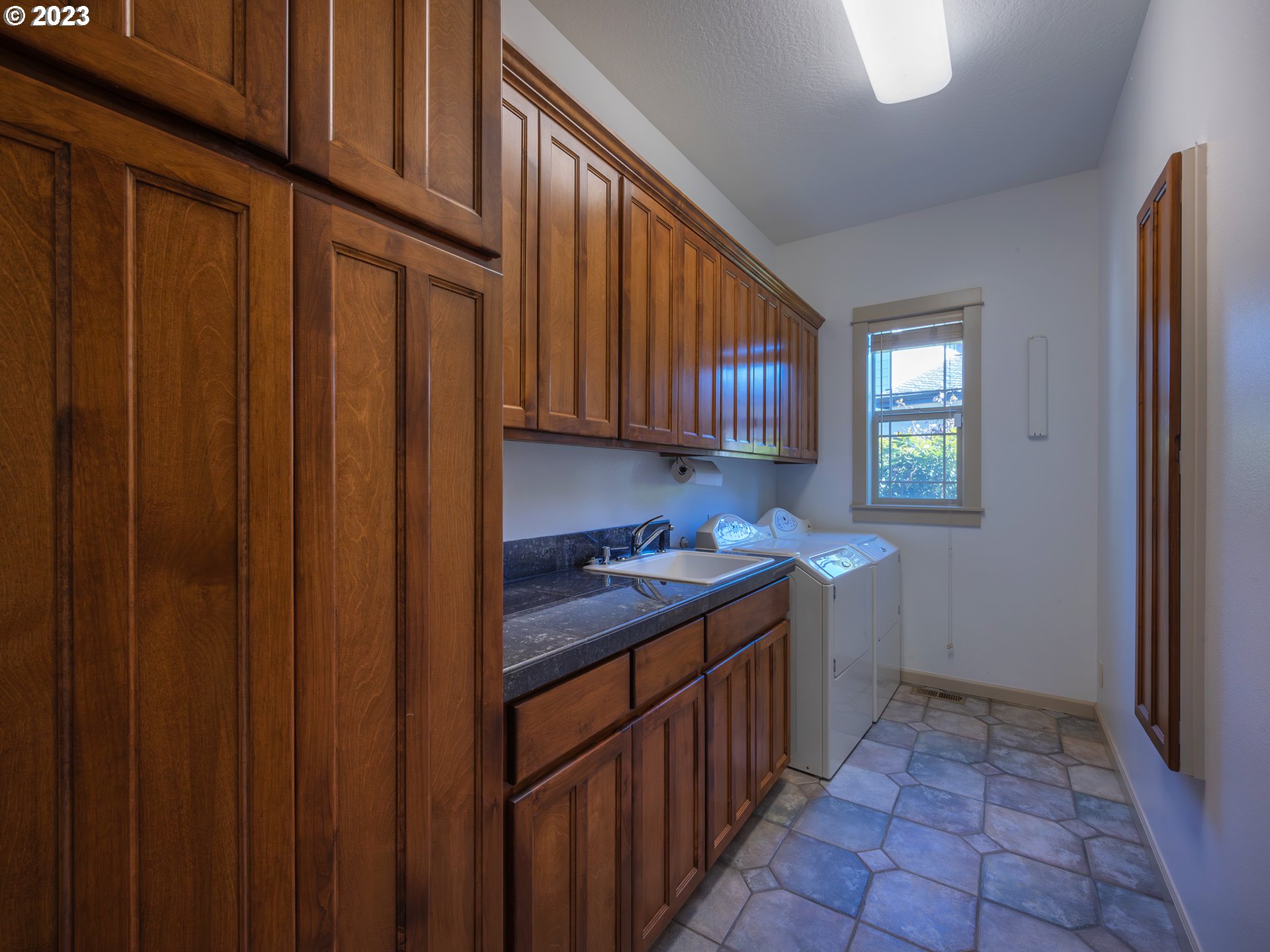 3384 Lakeside Drive Eugene, OR 97401 - Photo 36 of 48 a kitchen with a cabinets and window