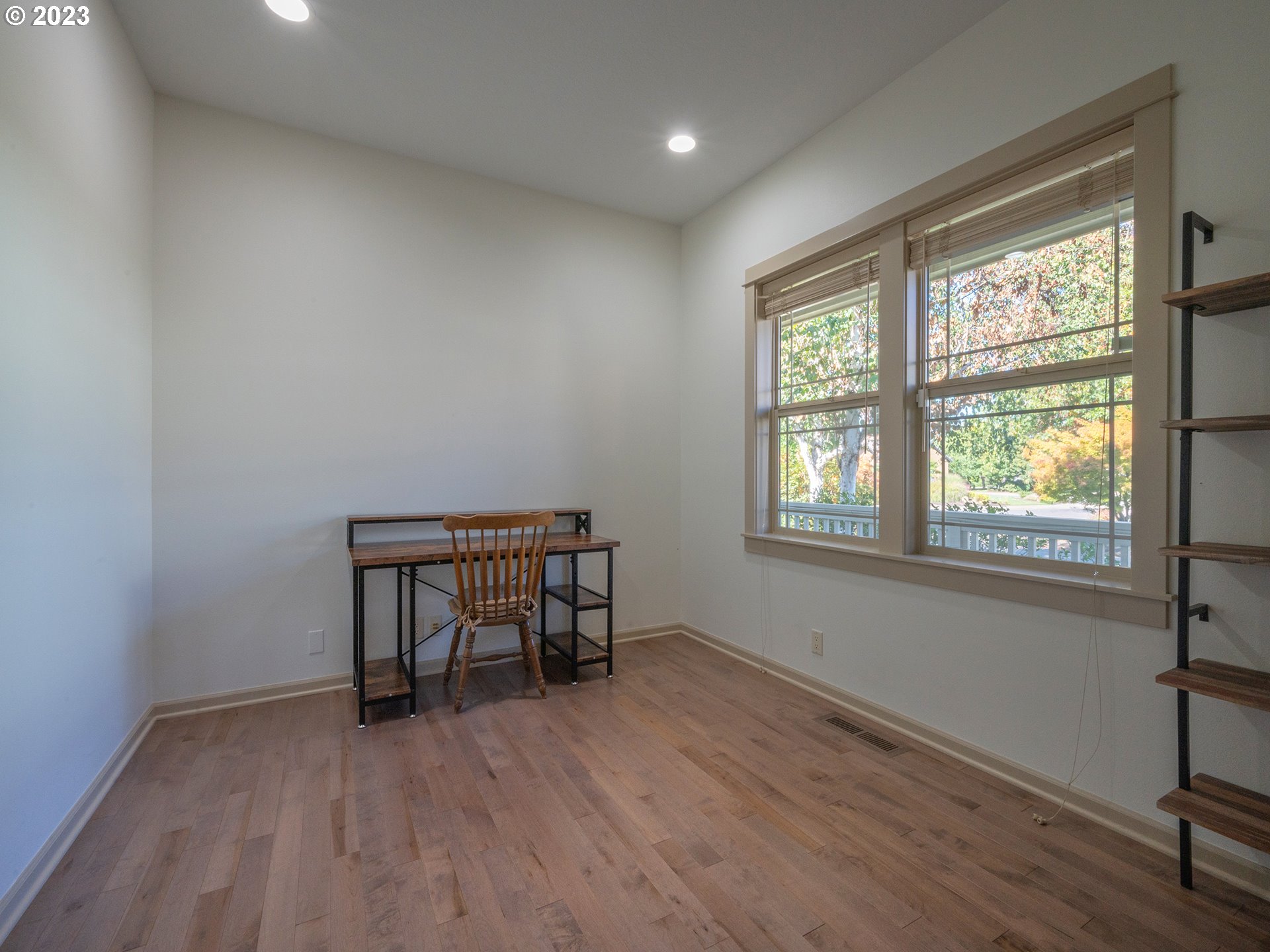 3384 Lakeside Drive Eugene, OR 97401 - Photo 38 of 48 an empty room with wooden floor and windows