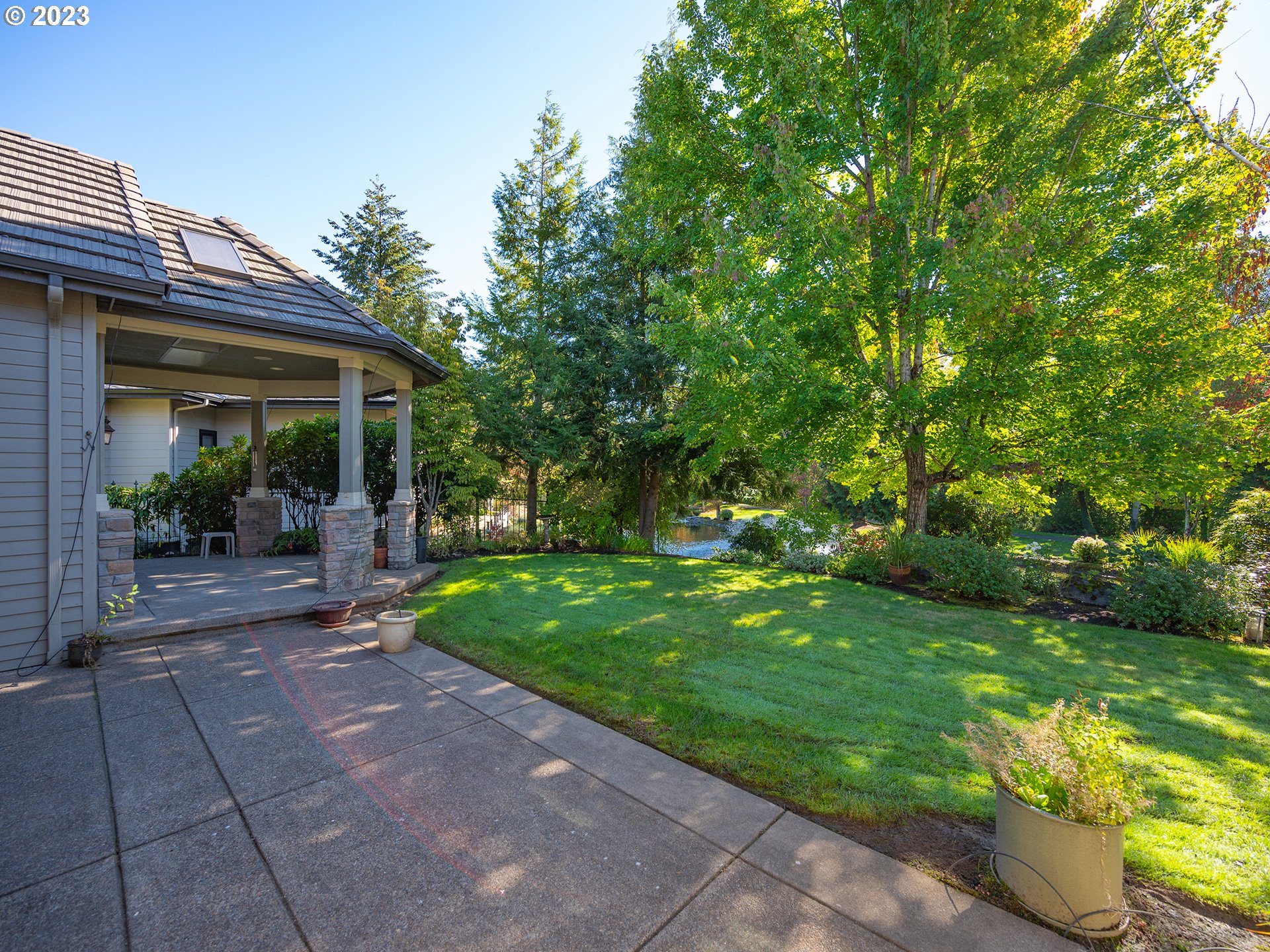 3384 Lakeside Drive Eugene, OR 97401 - Photo 40 of 48 a view of a patio with table and chairs and potted plants