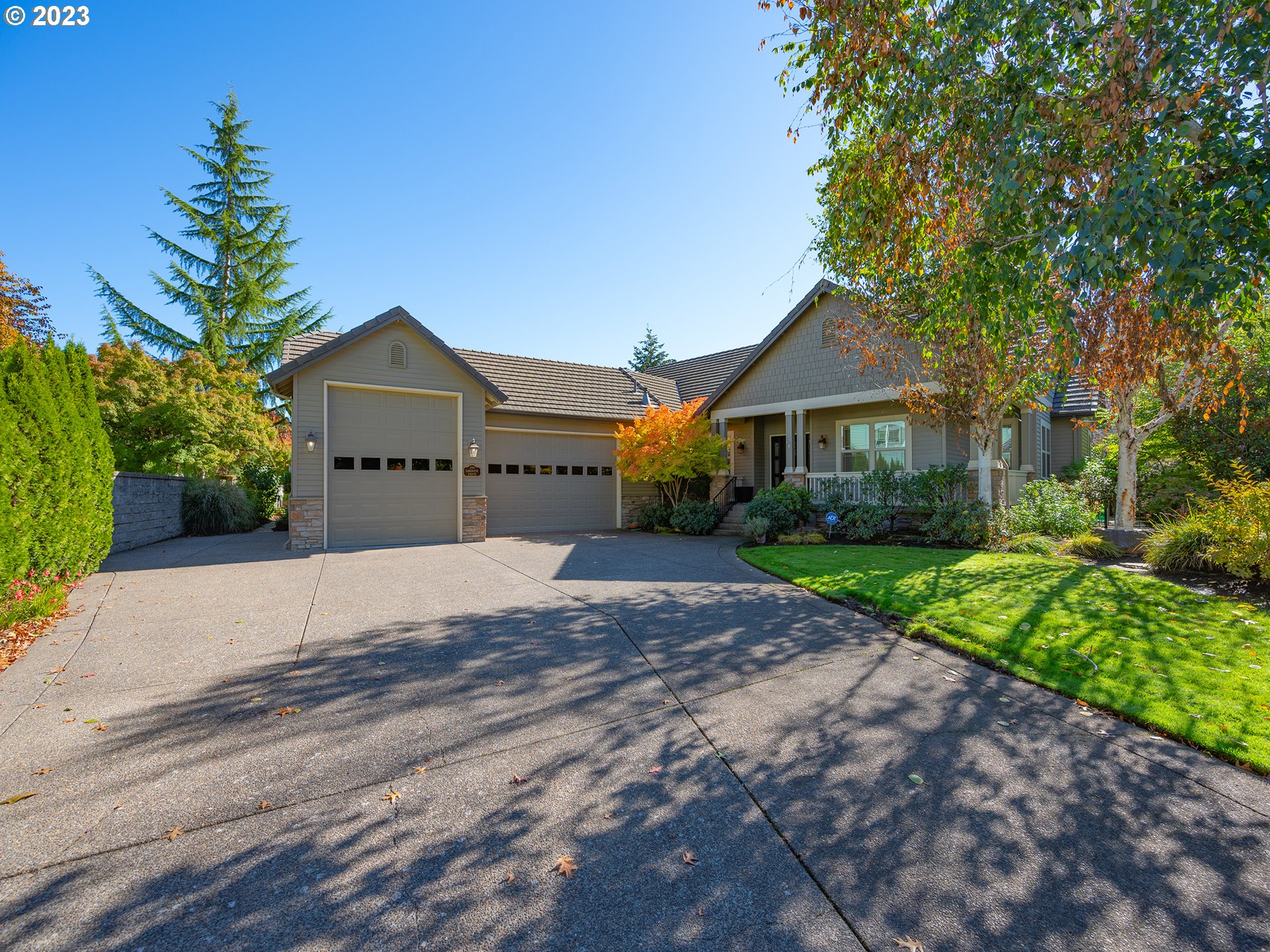 3384 Lakeside Drive Eugene, OR 97401 - Photo 42 of 48 a front view of a house with a yard and garage