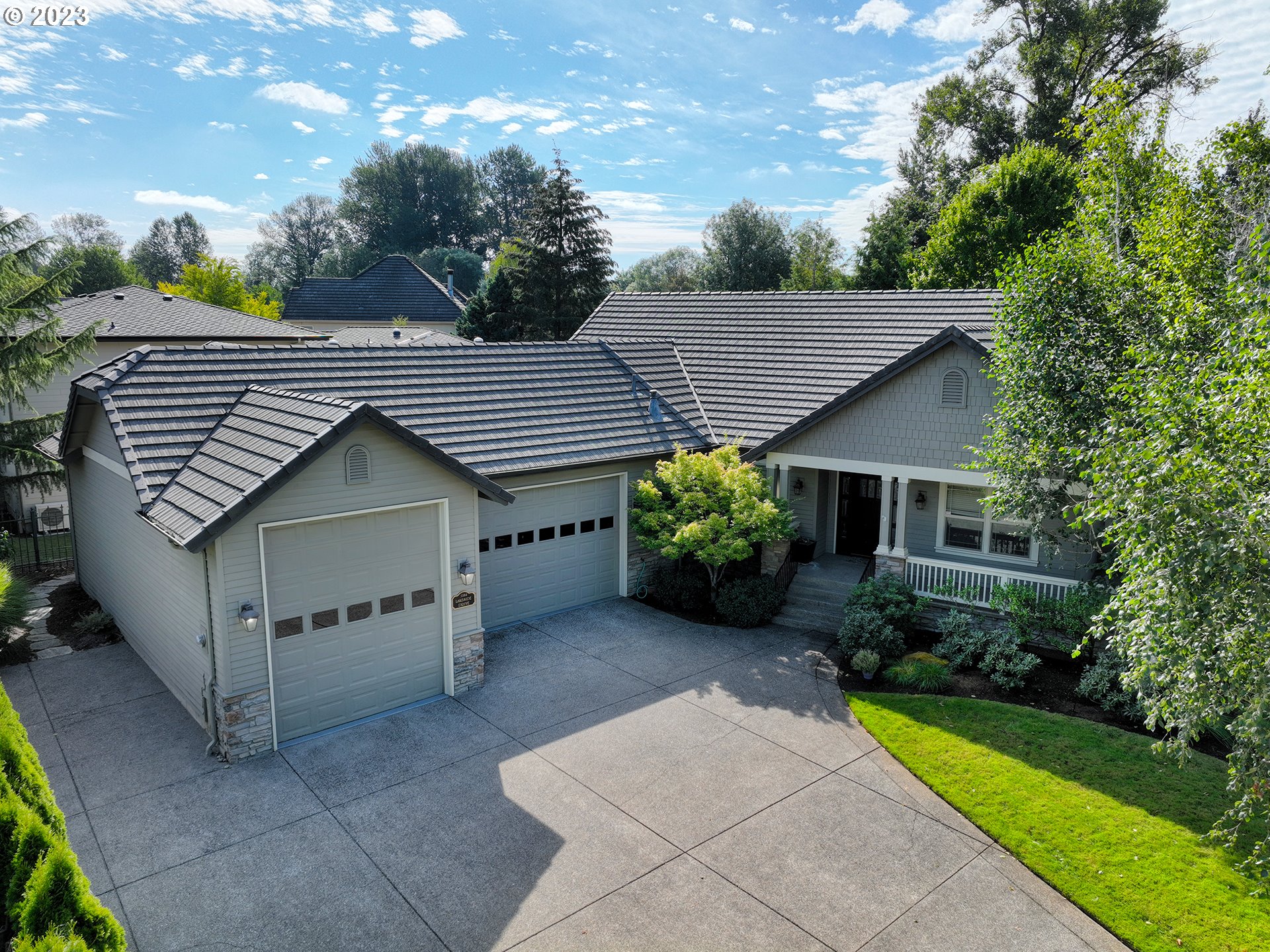 3384 Lakeside Drive Eugene, OR 97401 - Photo 43 of 48 a view of a house with a yard and plants
