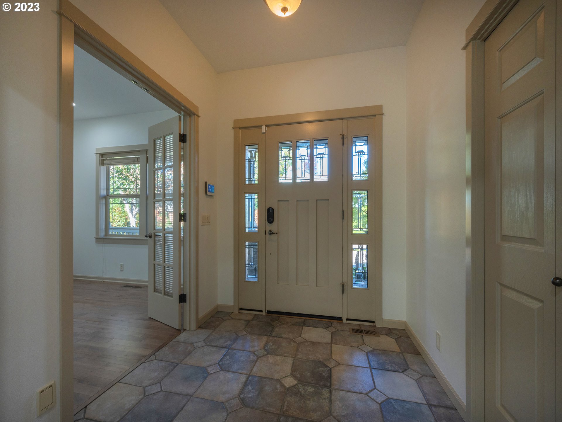 3384 Lakeside Drive Eugene, OR 97401 - Photo 10 of 48 a view of a hallway with wooden floor and a living room