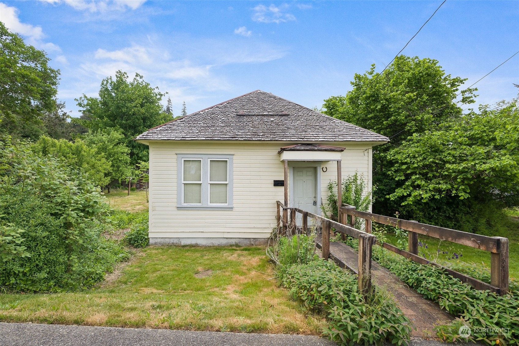 a front view of a house with garden