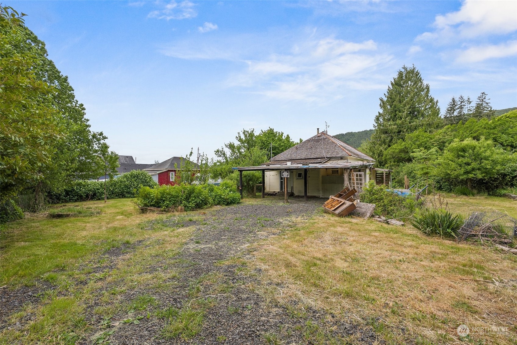 1235 Cedar Street Raymond, WA 98577 - Photo 18 of 23 a front view of a house with garden