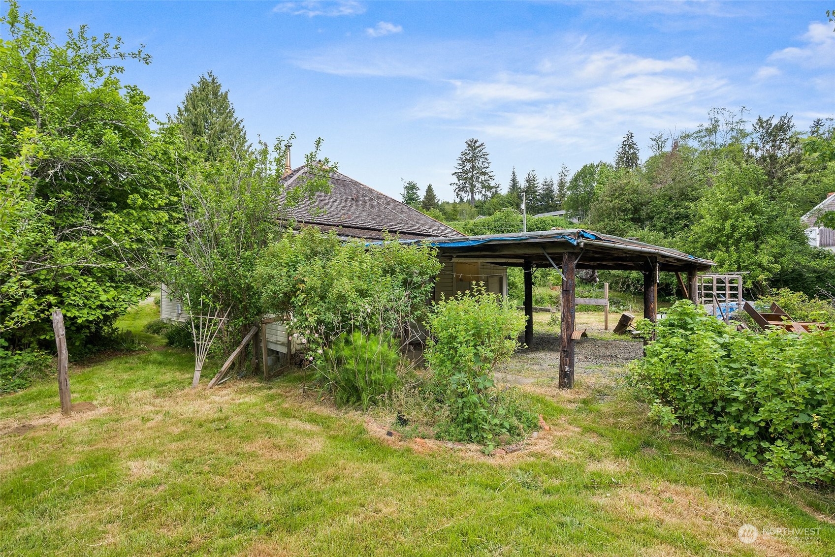 1235 Cedar Street Raymond, WA 98577 - Photo 19 of 23 a front view of a house with garden