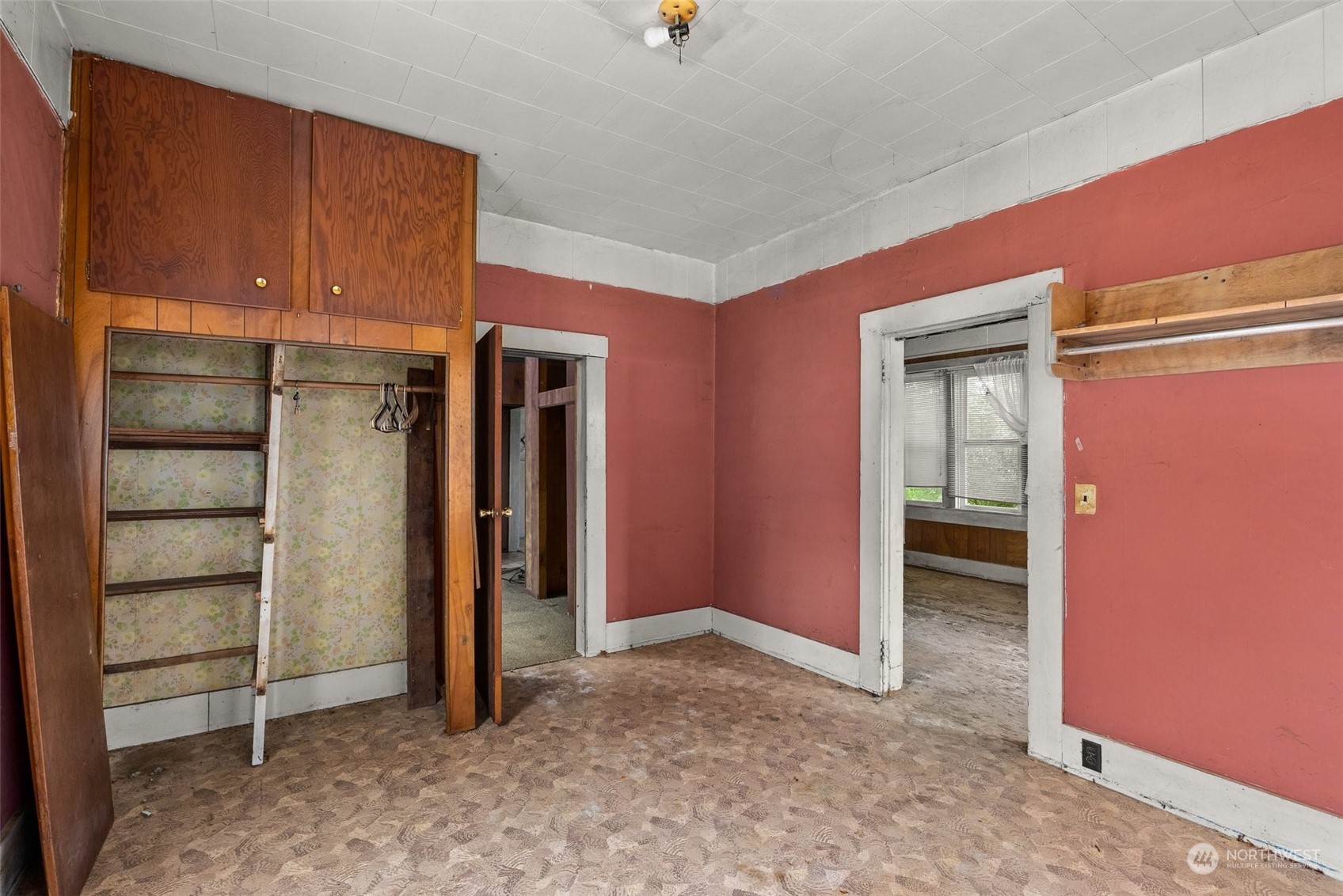 1235 Cedar Street Raymond, WA 98577 - Photo 7 of 23 a view of an empty room with cabinet and a window