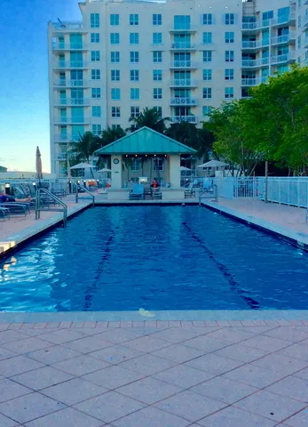 a view of swimming pool with outdoor seating