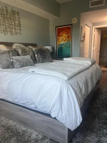 a bedroom with a bed and window