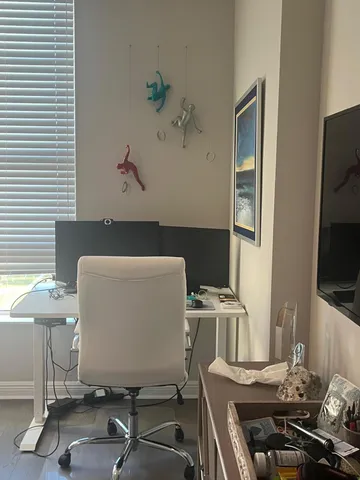 a workspace with furniture and a flat screen tv