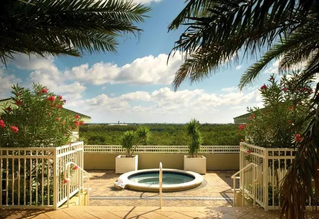 a terrace with outdoor seating and barbeque oven