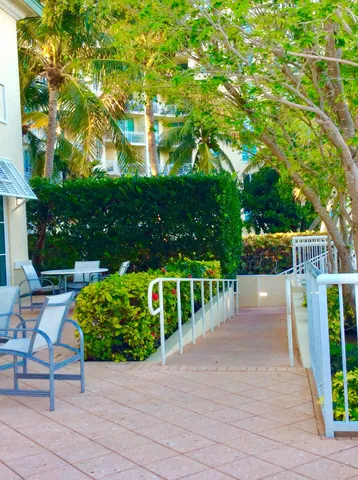a view of a chairs and tables in the backyard