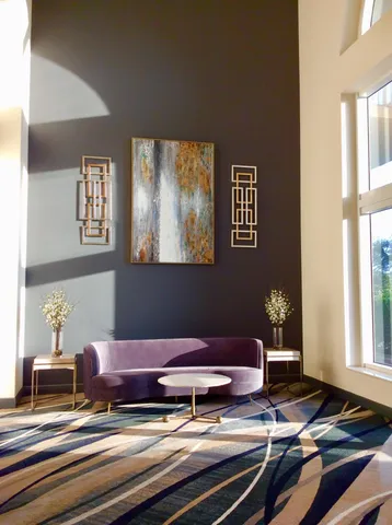 a living room with couch and window