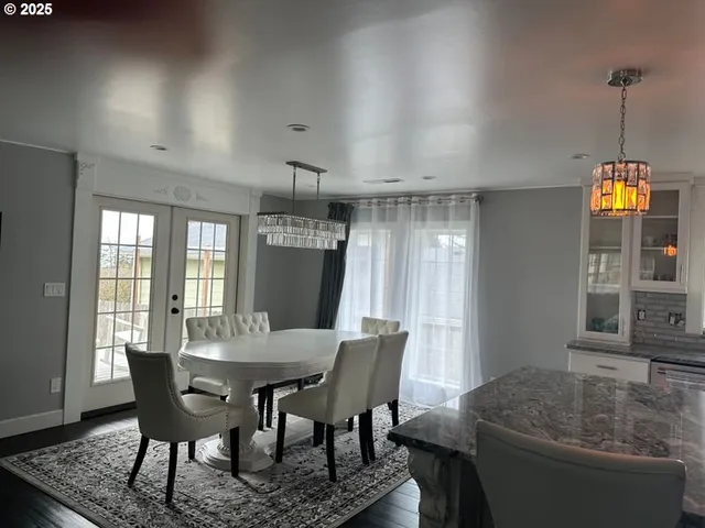 a dining room with furniture and window