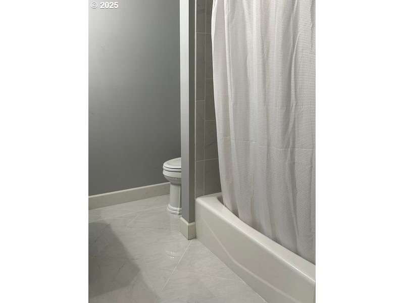 711 1st Street Brookings, OR 97415 - Photo 16 of 21 a bathroom with a toilet and a shower