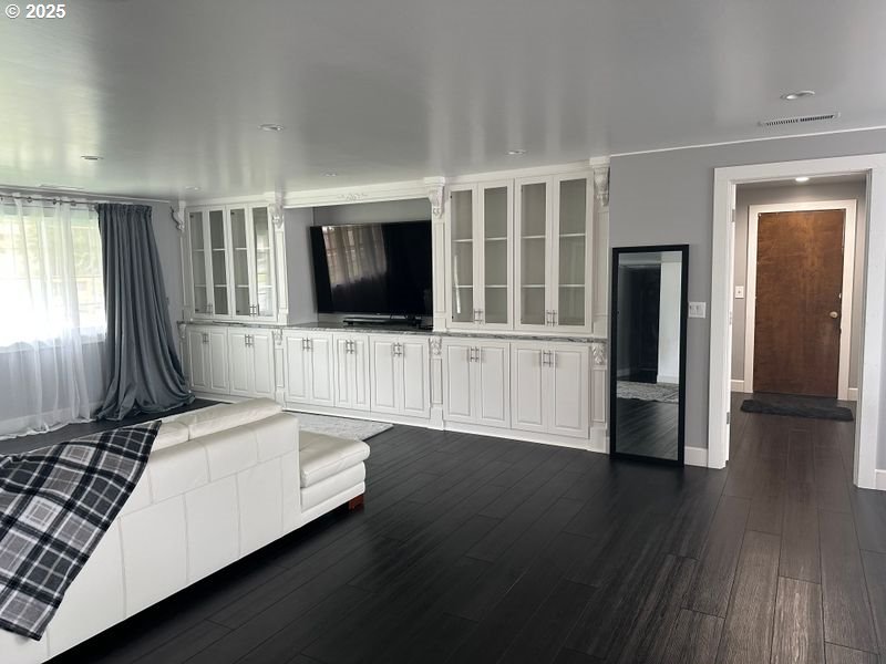 711 1st Street Brookings, OR 97415 - Photo 2 of 21 a hallway with wooden floor and mirror