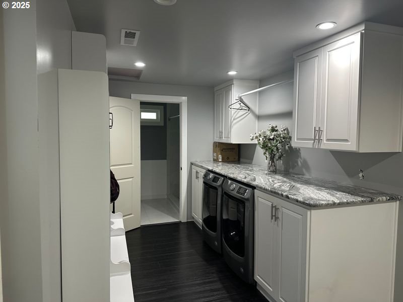 711 1st Street Brookings, OR 97415 - Photo 9 of 21 a bathroom with a granite countertop sink a toilet and a mirror