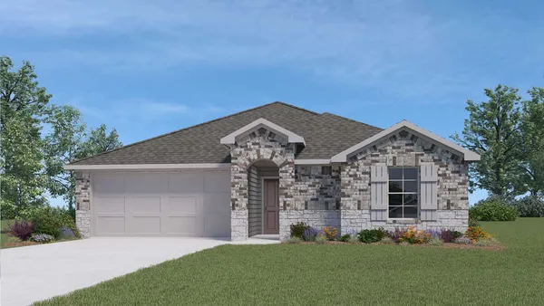a front view of a house with a garden and yard