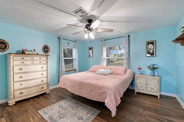 a bedroom with a bed and a dresser