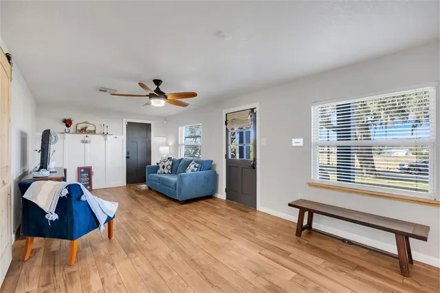 a living room with furniture and a window