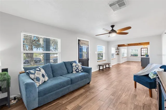 a living room with furniture and a window